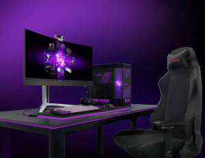 Gaming setup with monitor, desktop PC and gaming chair illuminated by purple ambient lighting