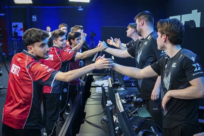 Players from two teams high-fiving after a completed CS2 match