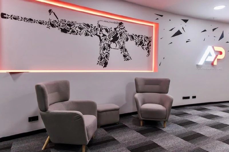 The lounge area of the A&P Performance Lab with neon wall graphics