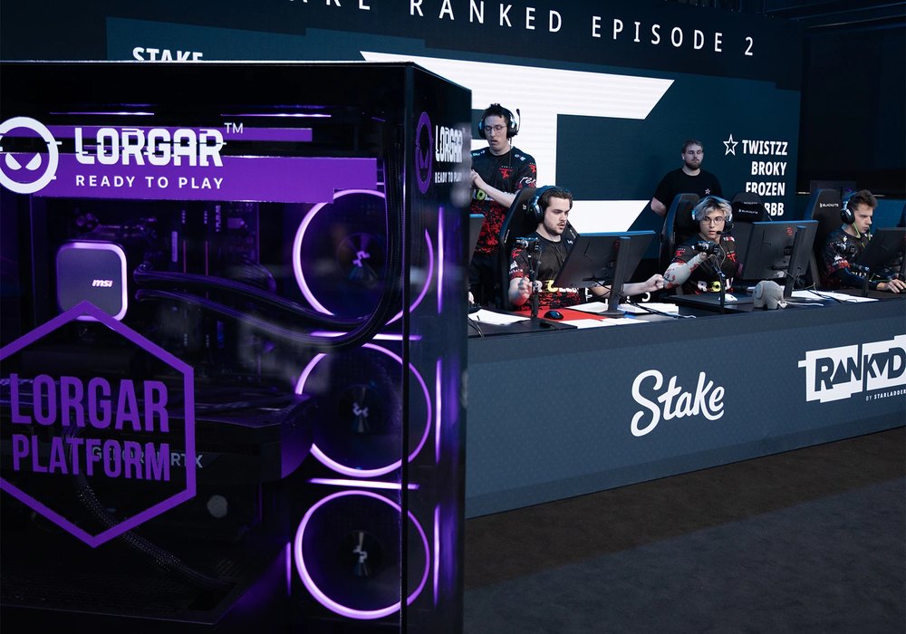 A Stake Ranked Episode 2 tournament station with a LORGAR PLATFORM computer in purple lighting